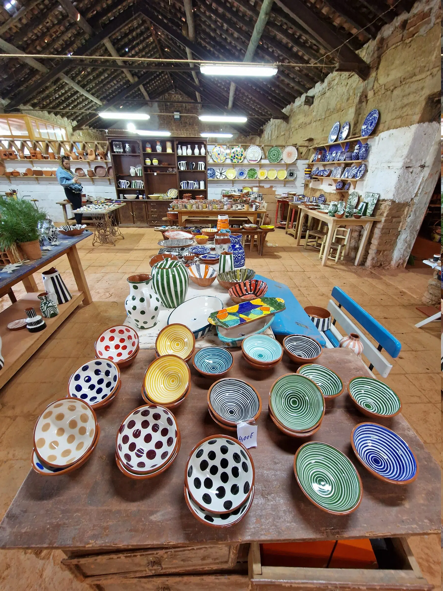 Inside a pottery in São Pedro do Corval, tables covered with freshly painted clay pieces.
